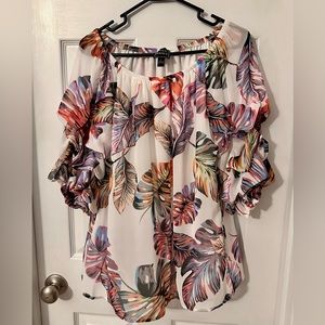 Colorful leaf light weight blouse with unique puffy layered sleeves.